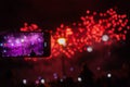 Happy family sitting on floor and watching the fireworks. Royalty Free Stock Photo