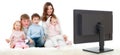 Happy family sitting on floor and watching TV Royalty Free Stock Photo