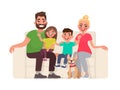 Happy family sitting on the sofa. Father, mother, son and daughter together at home Royalty Free Stock Photo