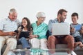 Happy family sitting on sofa Royalty Free Stock Photo