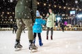 Happy family at the skating rink.