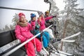 Happy family lifting on ski terrain Royalty Free Stock Photo