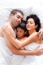 Happy family sleeping together