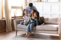 Happy family with small kids relax on couch cuddle together Royalty Free Stock Photo