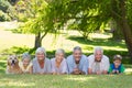 Happy family smiling at the camera with their dog Royalty Free Stock Photo