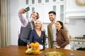 Happy family smiling taking selfie on smartphone when having birthday party Royalty Free Stock Photo