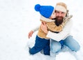 Happy family son hugs his dad on winter holiday. Merry Christmas and Happy New Year. Daddy and boy smiling and hugging. Royalty Free Stock Photo