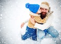 Happy family son hugs his dad on winter holiday. Merry Christmas and Happy New Year. Daddy and boy smiling and hugging. Royalty Free Stock Photo