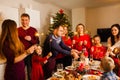 Happy family with sparklers having fun at dinner party at home Royalty Free Stock Photo