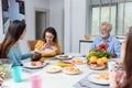 Happy family spend time having lunch or dinner on table together. Senior man enjoying while communicating with their family in din Royalty Free Stock Photo