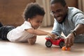 Happy family spending funny time together, playing with toys. Royalty Free Stock Photo