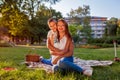 Happy family spending time outdoors having picnic in park. Mother with her son hugging and smiling. Family values Royalty Free Stock Photo