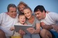 Happy family spending time with pad outdoor Royalty Free Stock Photo