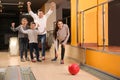 Happy family spending time together in bowling Royalty Free Stock Photo