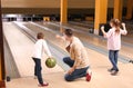 Happy family spending time together in bowling Royalty Free Stock Photo