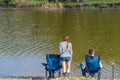 A happy family spends time together they teach their son to fish Royalty Free Stock Photo