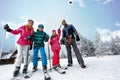 Family sport skiing and snowboarding time on sunny day