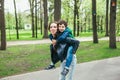 Happy family in spring park. Young mother and her son spending time outdoor on a summer day Royalty Free Stock Photo