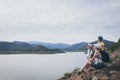 Happy family standing near the lake at the day time Royalty Free Stock Photo