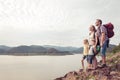 Happy family standing near the lake at the day time Royalty Free Stock Photo