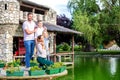 Happy family standing next to a lake Royalty Free Stock Photo