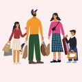 Happy family standing together and holding bags with purchases. Cute dad, mum, daughter and son are shopping. Royalty Free Stock Photo