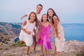 Happy family of four walking in the mountains on the sunset Royalty Free Stock Photo