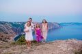 Happy family of four walking in the mountains on the sunset Royalty Free Stock Photo