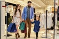 Happy family strolling in shopping mall