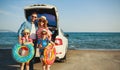 Happy   family  in summer auto journey travel by car on beach Royalty Free Stock Photo