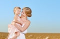 Happy family in summer nature. Mother and baby daughter in the w Royalty Free Stock Photo