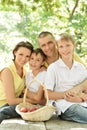 Happy family in summer parkr Royalty Free Stock Photo