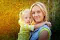 Happy family in the summer sunny rain. Portrait of Mother and daughter outdoors Royalty Free Stock Photo