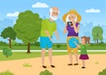 Happy family on summer walk, grandmother grandfather and girl play together in city park Royalty Free Stock Photo