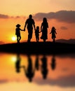 Happy family at sunset Royalty Free Stock Photo