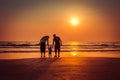 happy family on sunset beach in Arambol beach, North Goa, India Royalty Free Stock Photo