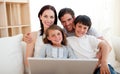 Happy family surfing the internet Royalty Free Stock Photo