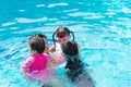 Happy family in swimming pool. Father and his children. Royalty Free Stock Photo