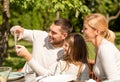 Happy family with tablet pc outdoors Royalty Free Stock Photo