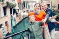 Happy family take a self photo on the one of bridges in Venice Royalty Free Stock Photo