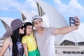 Happy family taking picture in sydney
