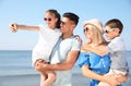 Happy family taking selfie at beach on sunny day Royalty Free Stock Photo