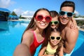 Family taking selfie near swimming pool.  Summer vacation Royalty Free Stock Photo