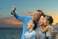 Happy family taking selfie on the sea beach Royalty Free Stock Photo