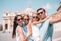 Happy family taking selfie in Vatican city and St. Peter`s Basilica church, Rome, Italy