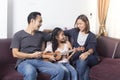 Happy family teaching daughter play ukulele Royalty Free Stock Photo