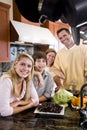 Happy family with teenage children in kitchen Royalty Free Stock Photo