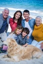 Happy family with their dog at the beach Royalty Free Stock Photo