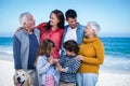 Happy family with their dog at the beach Royalty Free Stock Photo