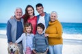 Happy family with their dog at the beach Royalty Free Stock Photo